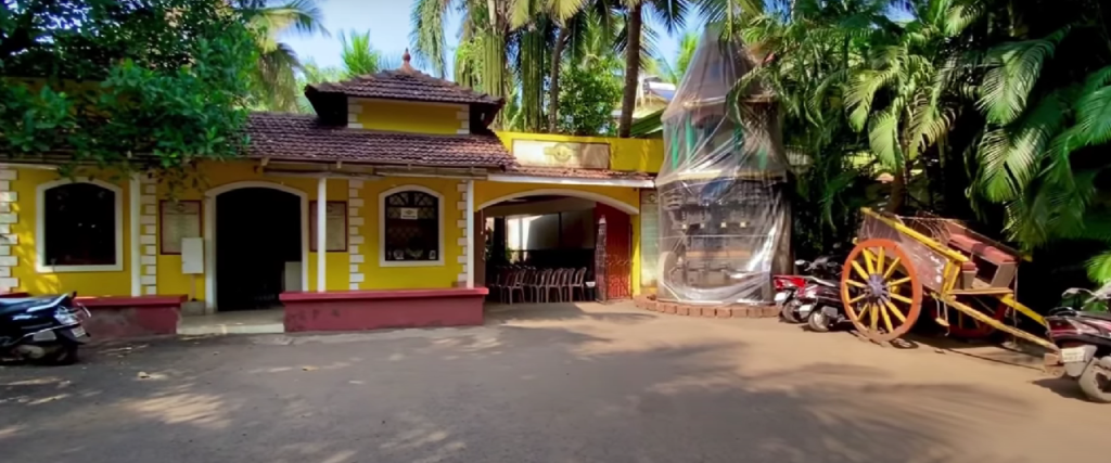 Entrance of Goa Chitra Museum showcasing traditional Goan architecture.
