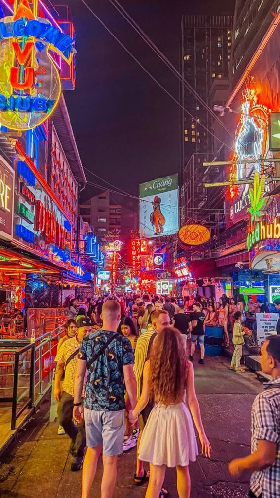 Soi Cowboy nightlife in Bangkok, vibrant and lively, perfect for Delhi to Bangkok flight travelers.