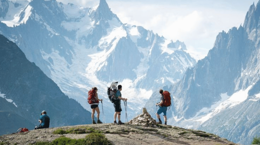 Traveler trekking through scenic hills at one of the most popular tourist destinations of 2025